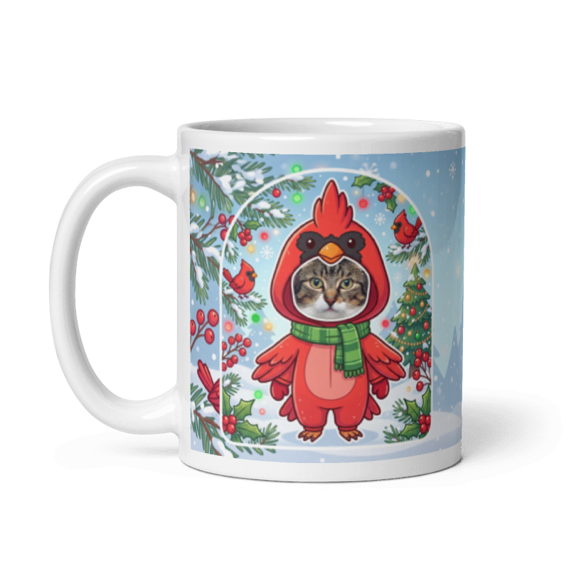 The same cat cardinal mug with the handle on the left, the cat's face still showing