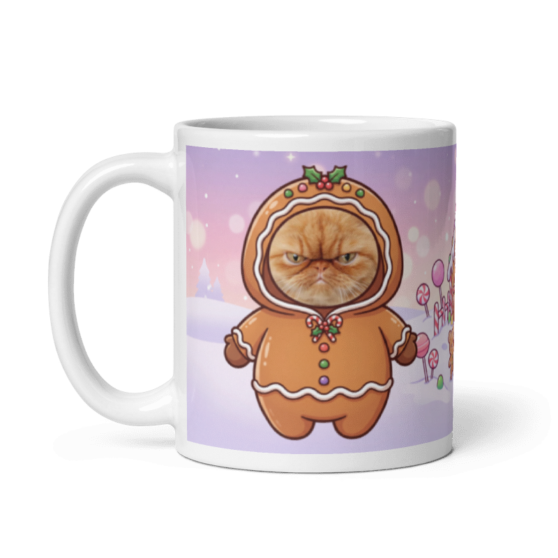 The same cat gingerbread mug with the handle on the left, the cat's face still showing