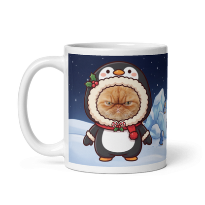 The same cat penguin mug with the handle on the left, the cat's face still showing